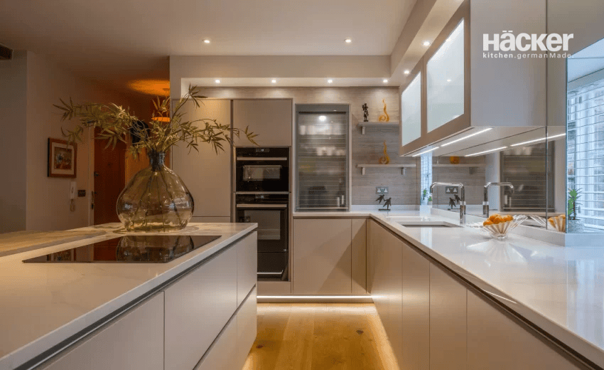 Industrial-style kitchen conversion in a former Arundel brewery with slate cladding and gold accents