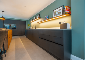 Modern open-plan kitchen sink run with quooker tap and open shelving