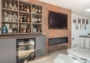 black and white kitchen with exposed brick wall