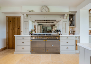 Bespoke shaker kitchen with range cooker and mantel.